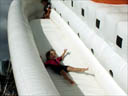[ Katie takes a slide down the Tot-Tanic. ]
