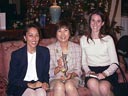 [ Dec. 14 -- The office Christmas Party starts at the Plaza Club downtown. Pictured are wonder-woman Bernice Bowers, associate Janice Koh and intern Colleen Mooney. ]